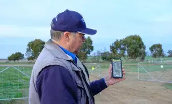 Livestock farmer with app crop